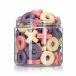 Gummy Hugs and Kisses candy package featuring a vibrant pink, purple, and white assortment of X and O shaped chewy sweets and confections from a 100% peanut and tree nut free facility.